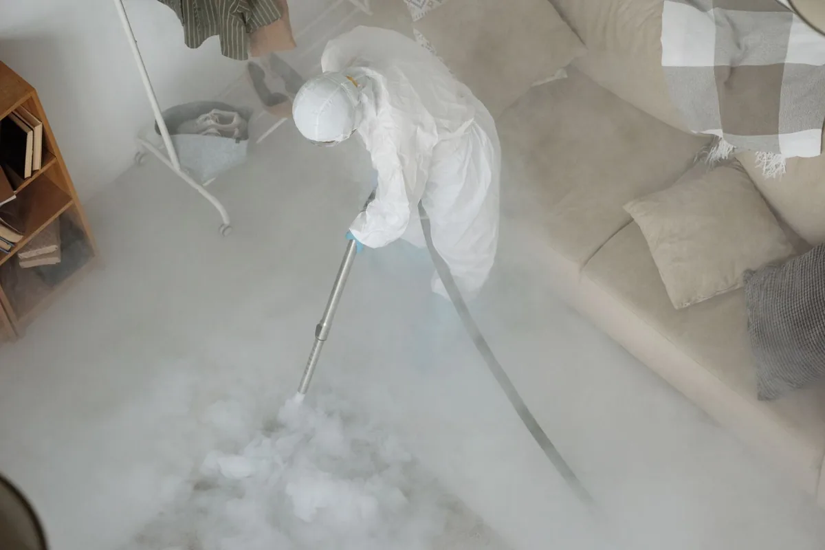 Biohazard cleanup technician in protective equipment, Spencer, IA